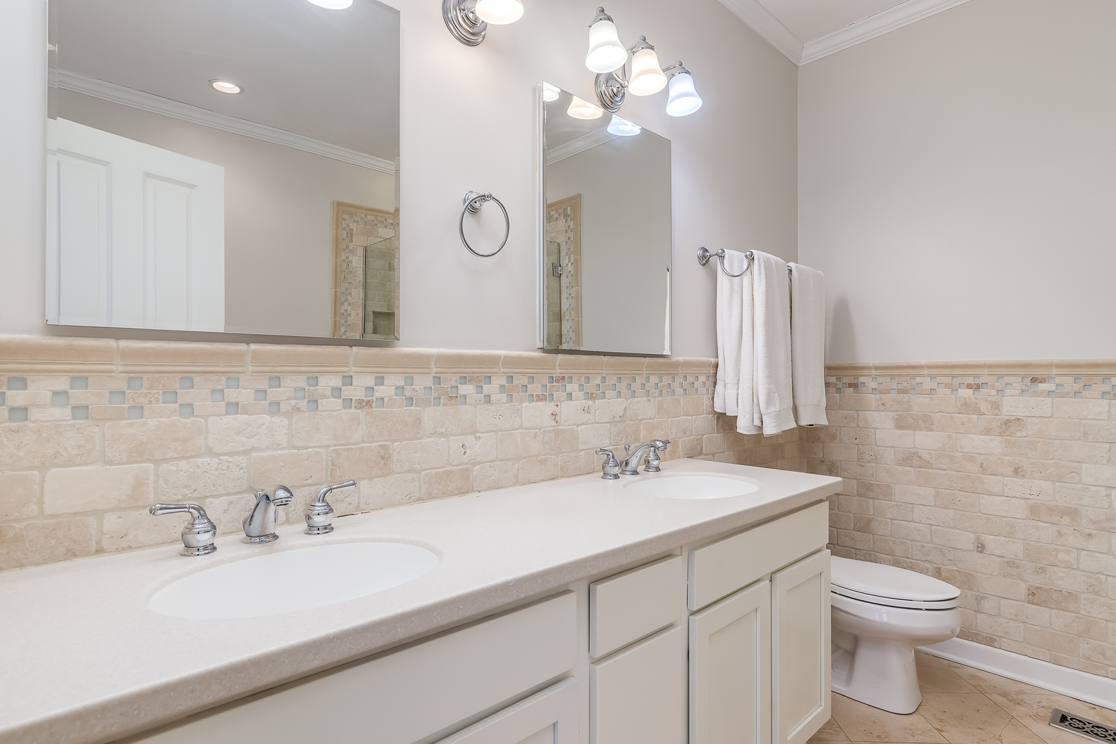 847 North May Street Chicago, IL 60642 - Photo 21 of 32 a bathroom with a sink a toilet and a mirror