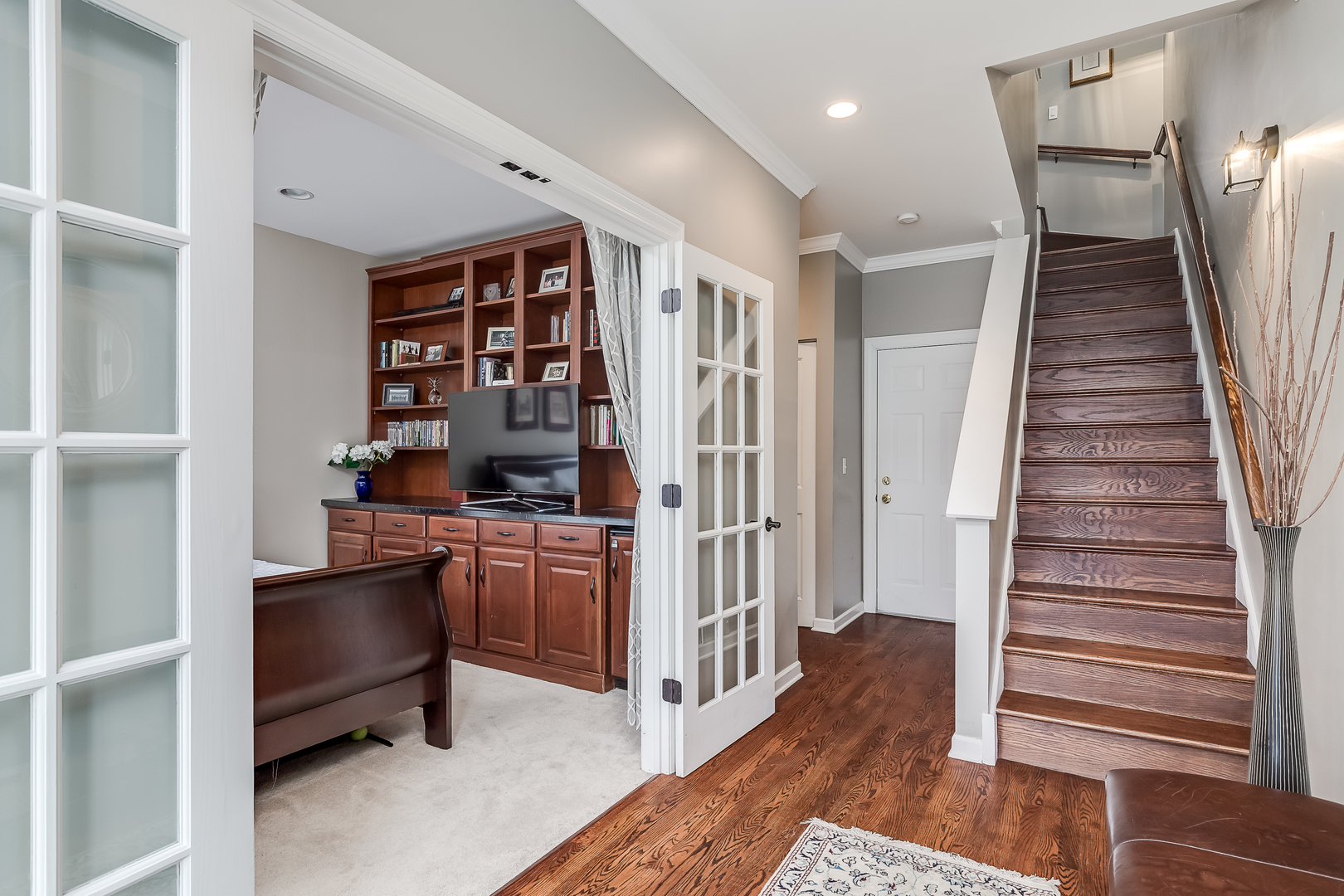 847 North May Street Chicago, IL 60642 - Photo 4 of 32 a view of a hallway with workspace and wooden floor