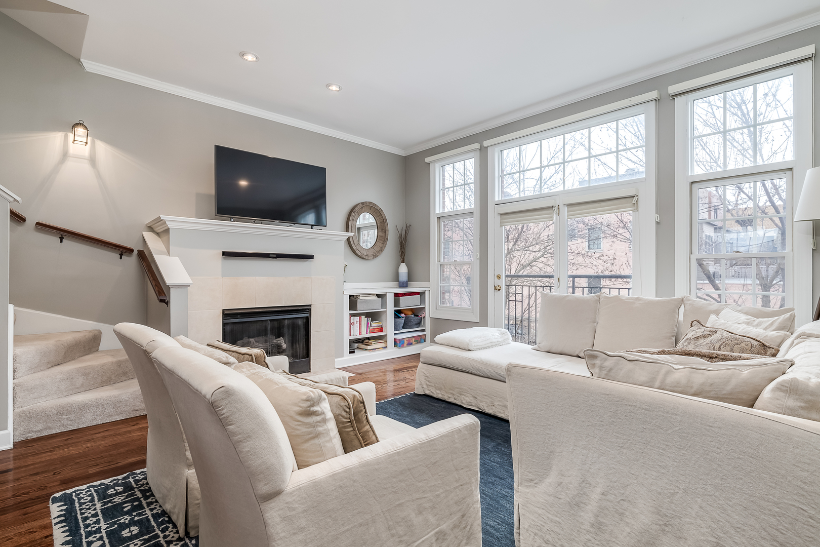 847 North May Street Chicago, IL 60642 - Photo 7 of 32 a living room with furniture a large window and a fireplace