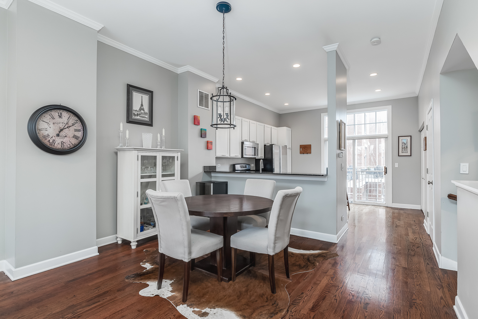 847 North May Street Chicago, IL 60642 - Photo 9 of 32 a dining room with furniture and a clock