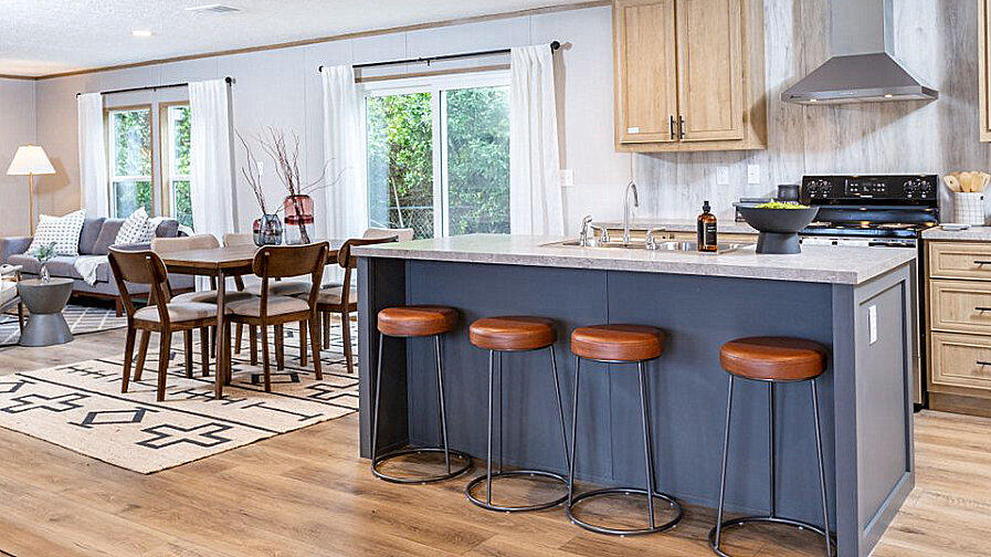 Lot 5 Goodview Town Road Moneta, VA 24121 - Photo 5 of 18 a kitchen with granite countertop a table chairs stove and cabinets