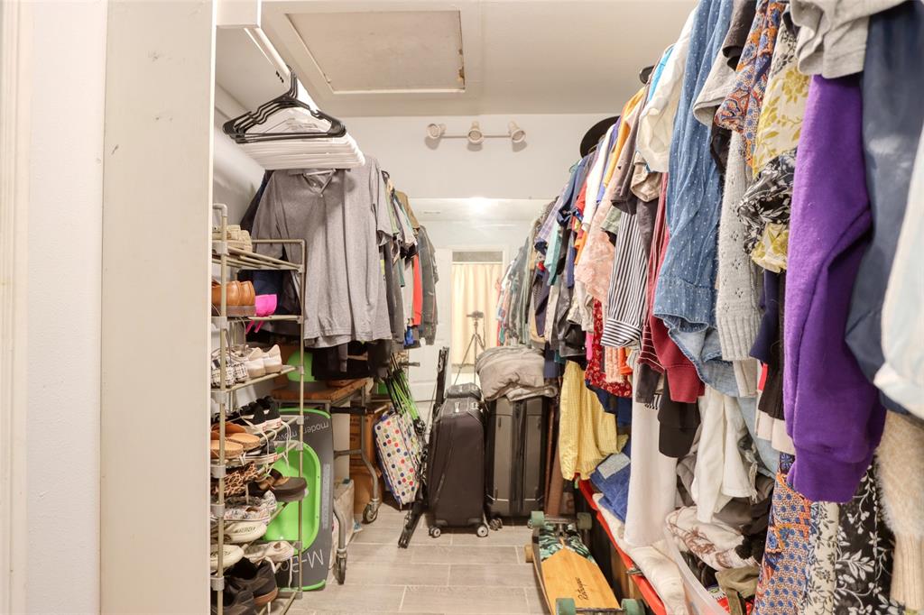 305 East Belt Line Road Wilmer, TX 75172 - Photo 12 of 16 a view of walk in closet with clothes