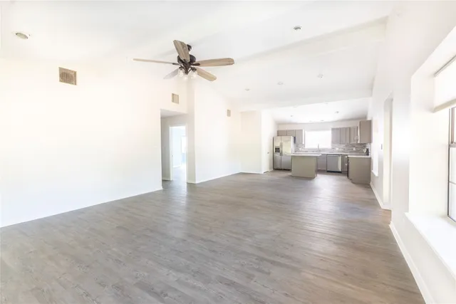 a view of a kitchen with a sink and a window