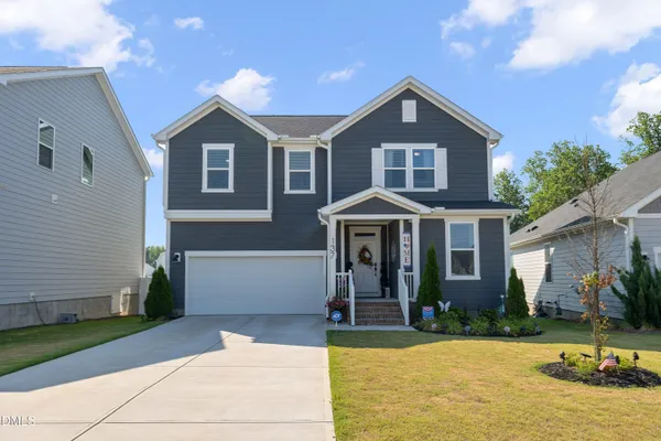 a front view of a house with a yard