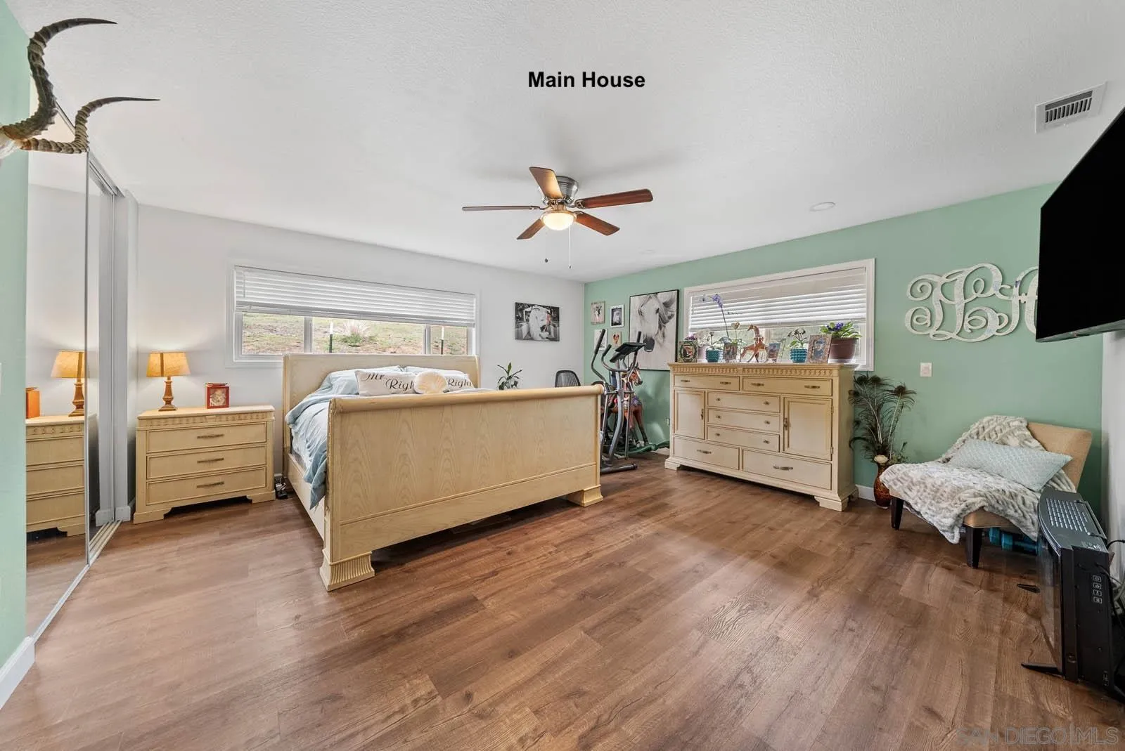 21908 Japatul Lane Alpine, CA 91901 - Photo 12 of 47 a living room with furniture and a flat screen tv