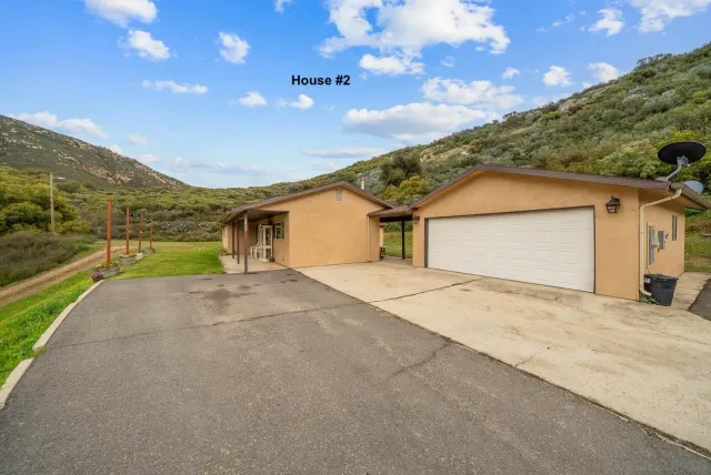 a view of garage and yard