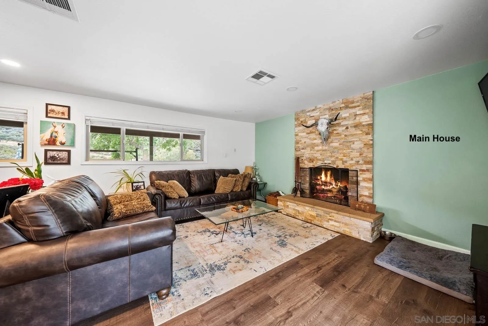 21908 Japatul Lane Alpine, CA 91901 - Photo 2 of 47 a living room with furniture and a fireplace