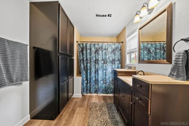 a kitchen with a sink a refrigerator and window
