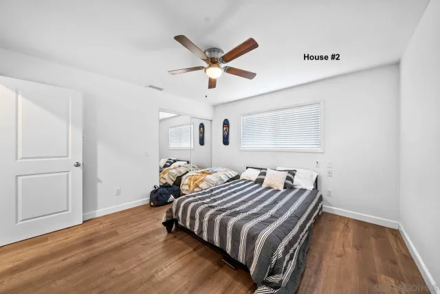 a bedroom with bed and a window