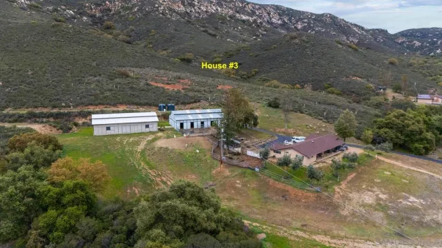 a aerial view of a house with a yard