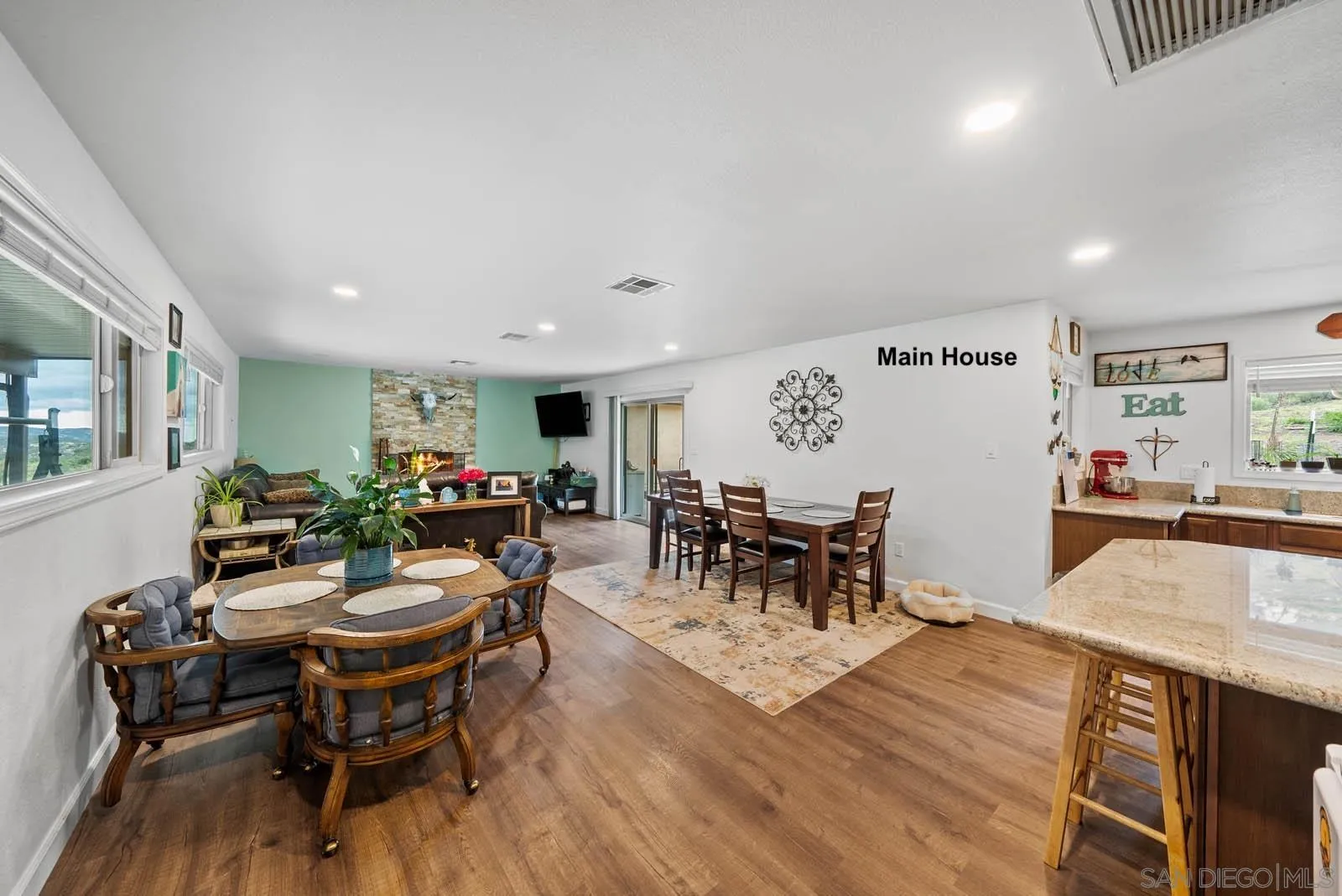 21908 Japatul Lane Alpine, CA 91901 - Photo 4 of 47 a view of a dining room with furniture and chandelier