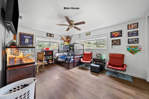 a play room with furniture and a flat screen tv