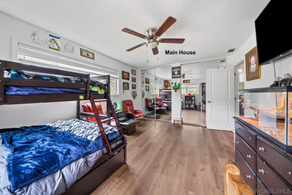 a bed room with a bed and a flat screen tv