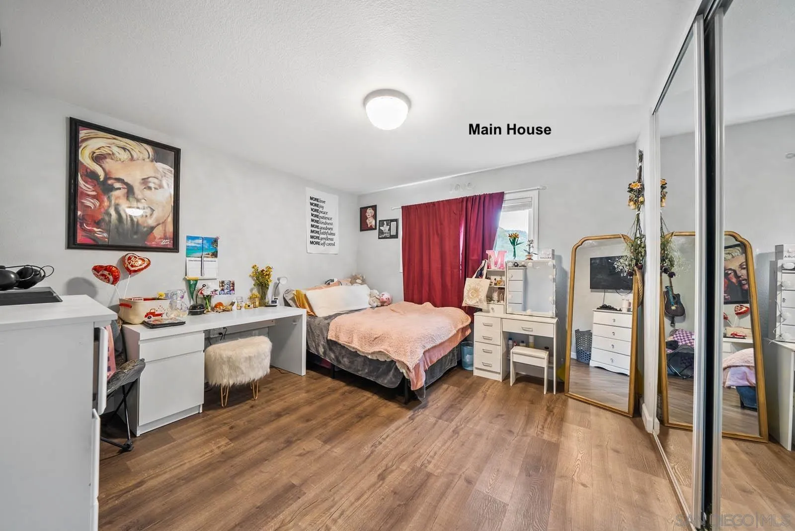 21908 Japatul Lane Alpine, CA 91901 - Photo 10 of 47 a living room with furniture and a flat screen tv