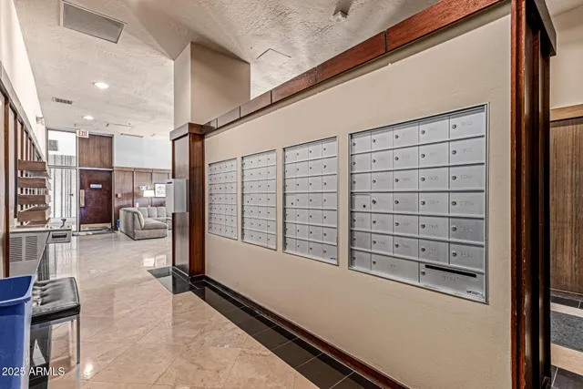 a view of walk in closet with clothes