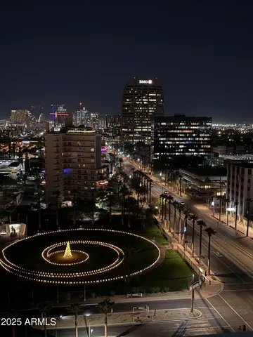 a view of a balcony with furniture and city view