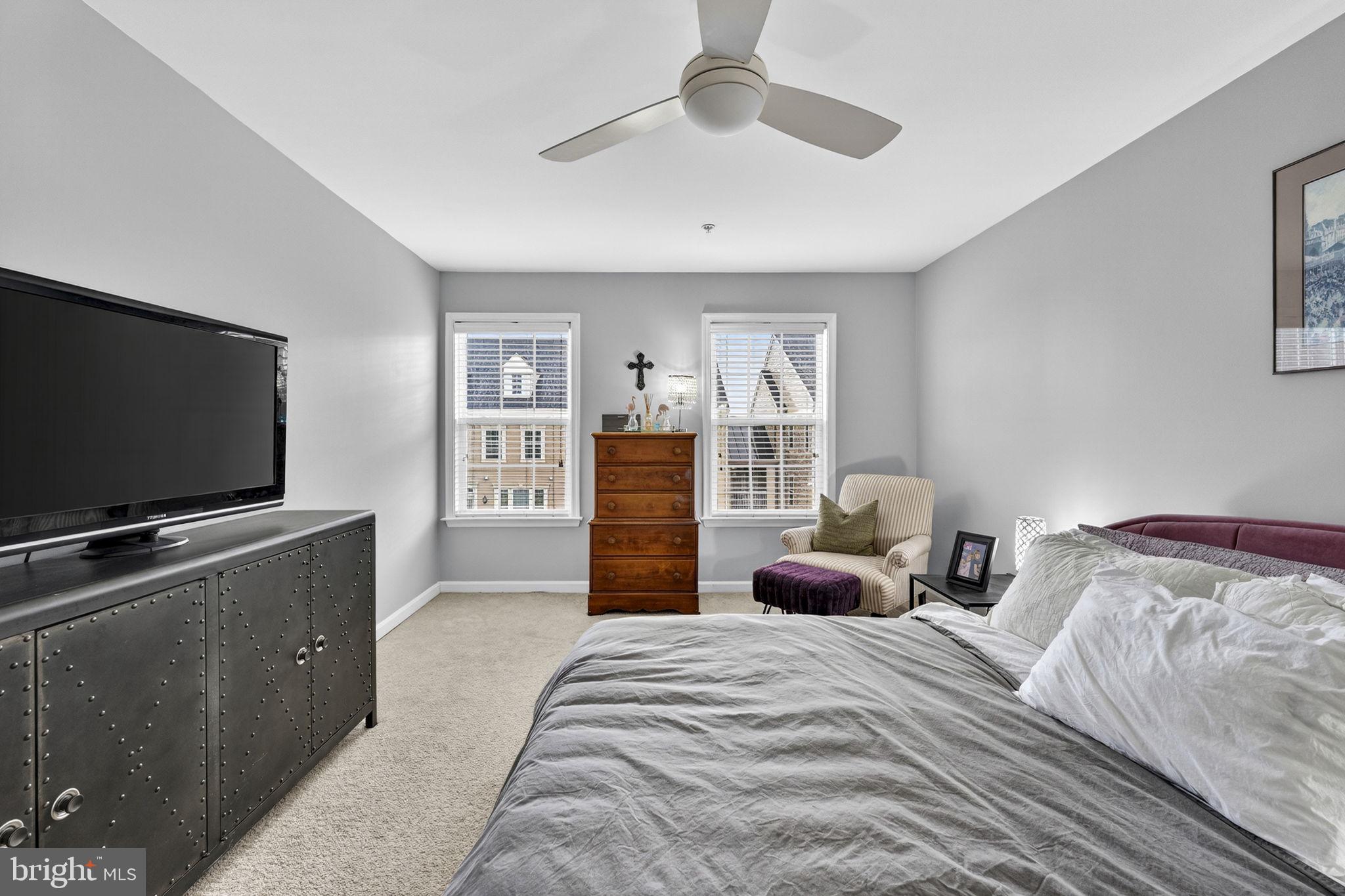 42558 Sunset Ridge Square Ashburn, VA 20148 - Photo 35 of 51 a bedroom with a bed and a flat screen tv