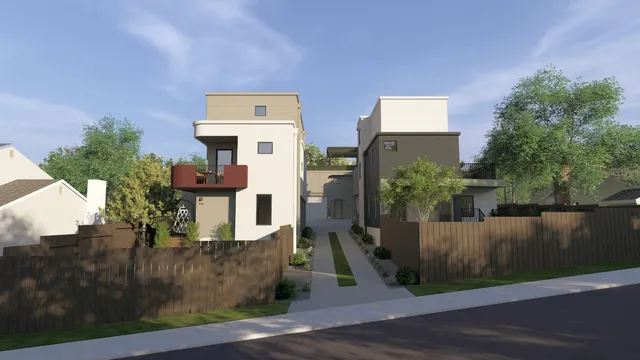 a front view of a house with trees