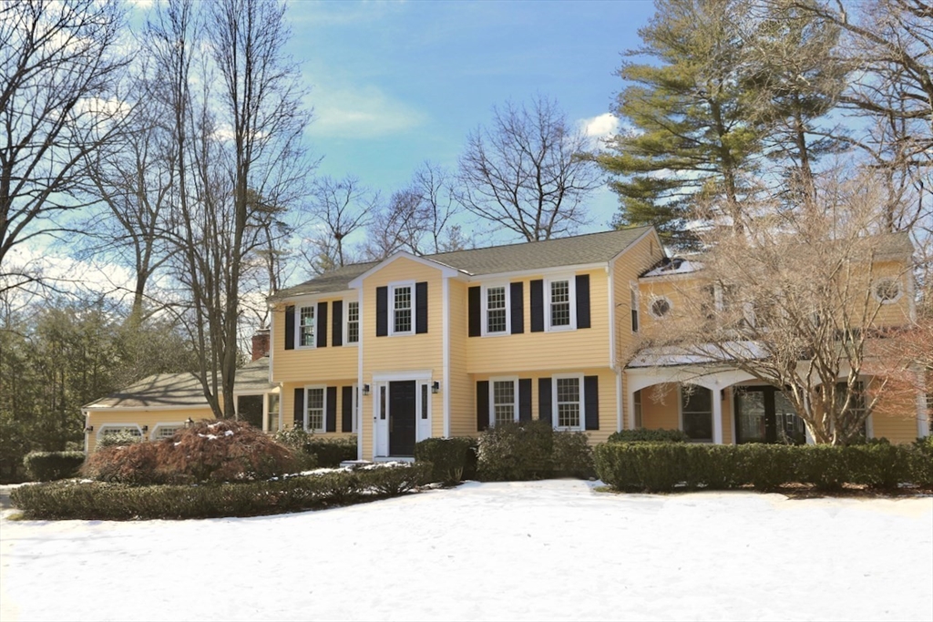 5 Madison Lane Acton, MA 01720 - Photo 1 of 26 a view of a white house with a yard covered in snow