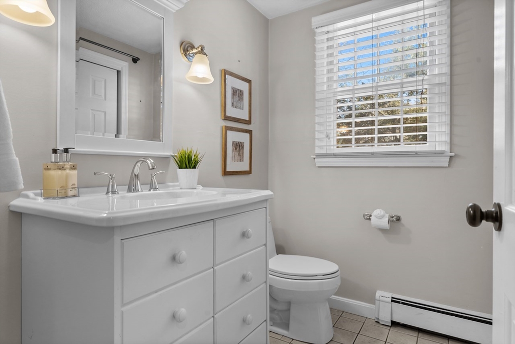 5 Madison Lane Acton, MA 01720 - Photo 12 of 26 a bathroom with a granite countertop toilet sink and mirror