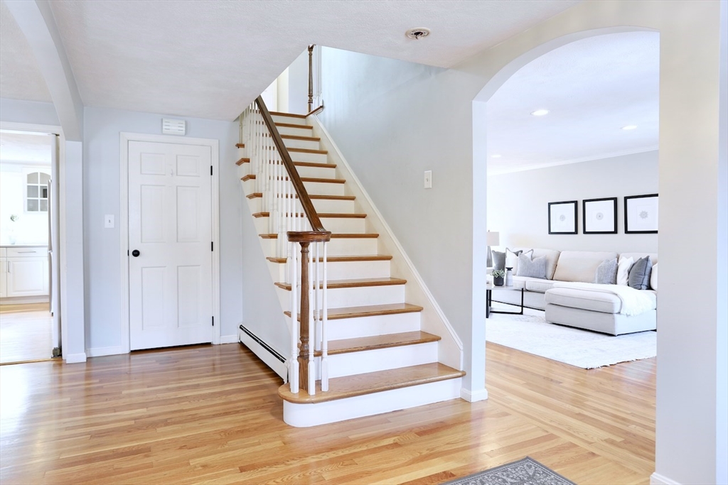5 Madison Lane Acton, MA 01720 - Photo 13 of 26 a view of entryway and hall with wooden floor