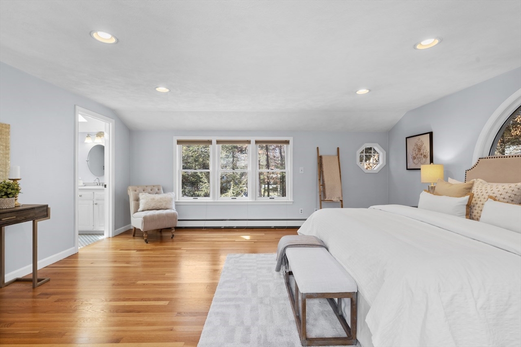 5 Madison Lane Acton, MA 01720 - Photo 15 of 26 a spacious bedroom with a large bed and a large window