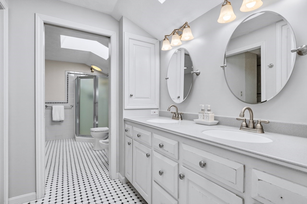 5 Madison Lane Acton, MA 01720 - Photo 16 of 26 a spacious bathroom with a double vanity sink and a mirror
