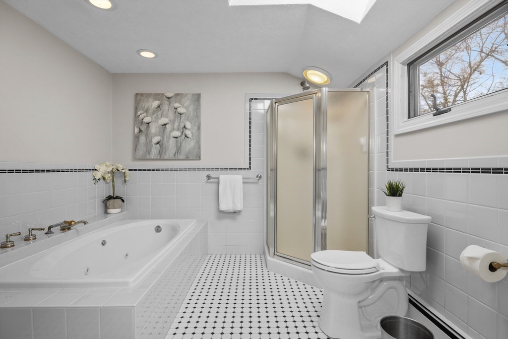 5 Madison Lane Acton, MA 01720 - Photo 17 of 26 a bathroom with a sink a toilet and shower