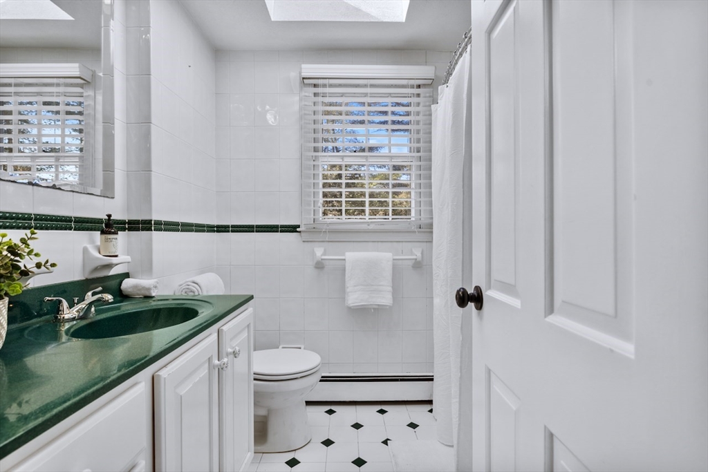 5 Madison Lane Acton, MA 01720 - Photo 20 of 26 a bathroom with a sink a toilet and shower