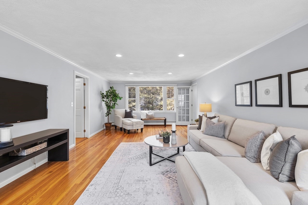 5 Madison Lane Acton, MA 01720 - Photo 2 of 26 a living room with furniture and a flat screen tv