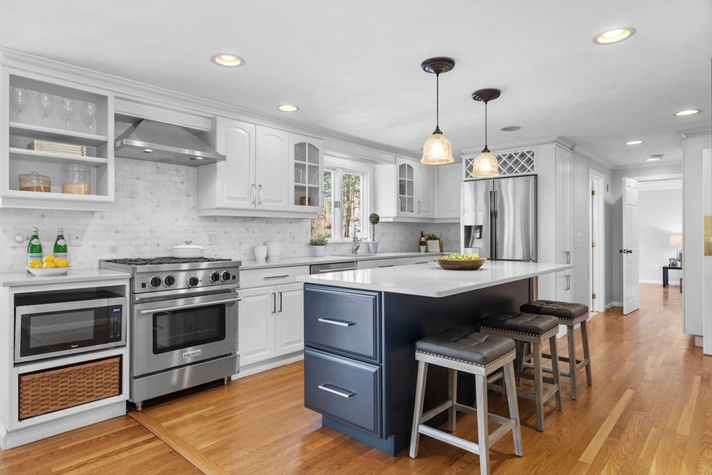 5 Madison Lane Acton, MA 01720 - Photo 3 of 26 a kitchen with a sink stove and wooden floor