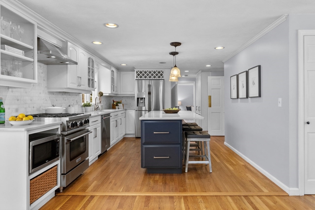 5 Madison Lane Acton, MA 01720 - Photo 4 of 26 a kitchen with a stove a sink and a refrigerator