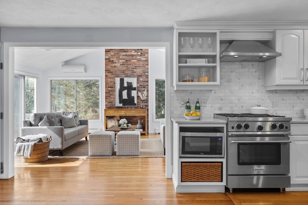 5 Madison Lane Acton, MA 01720 - Photo 7 of 26 a kitchen with stainless steel appliances a stove and white cabinets
