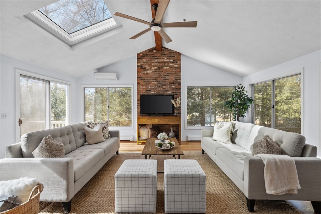 5 Madison Lane Acton, MA 01720 - Photo 8 of 26 a living room with furniture fireplace and a large window
