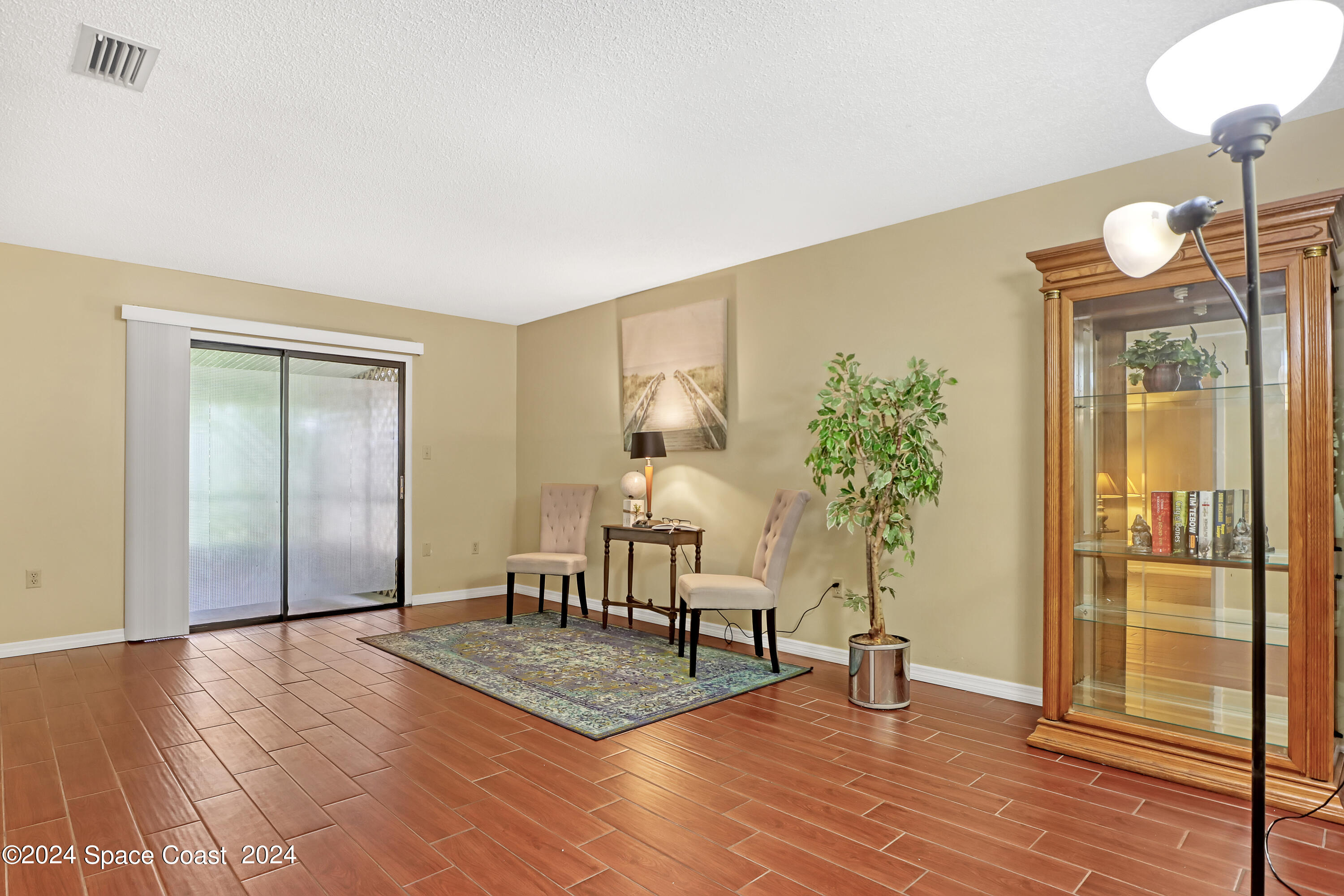 4733 Sisson Road Titusville, FL 32780 - Photo 17 of 26 a living room with furniture and wooden floor