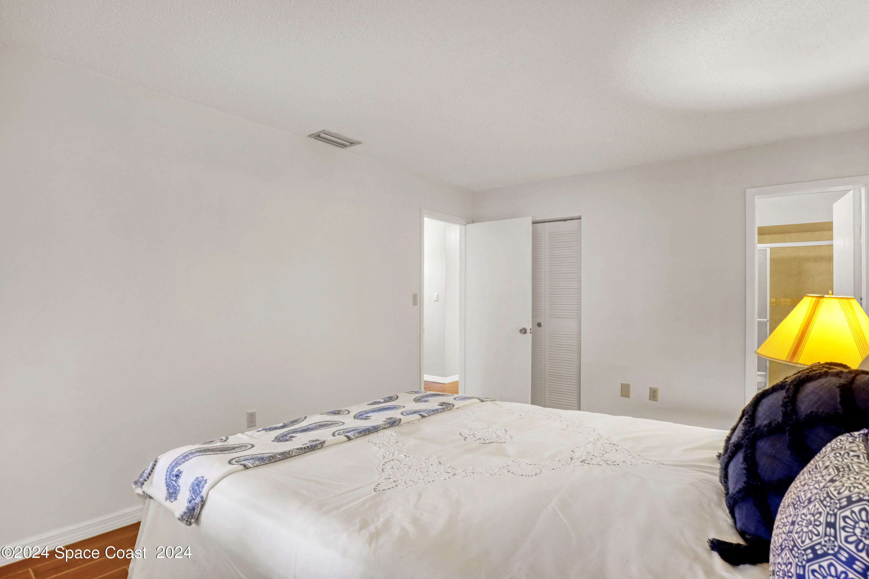 4733 Sisson Road Titusville, FL 32780 - Photo 18 of 26 a bedroom with a bed and bed