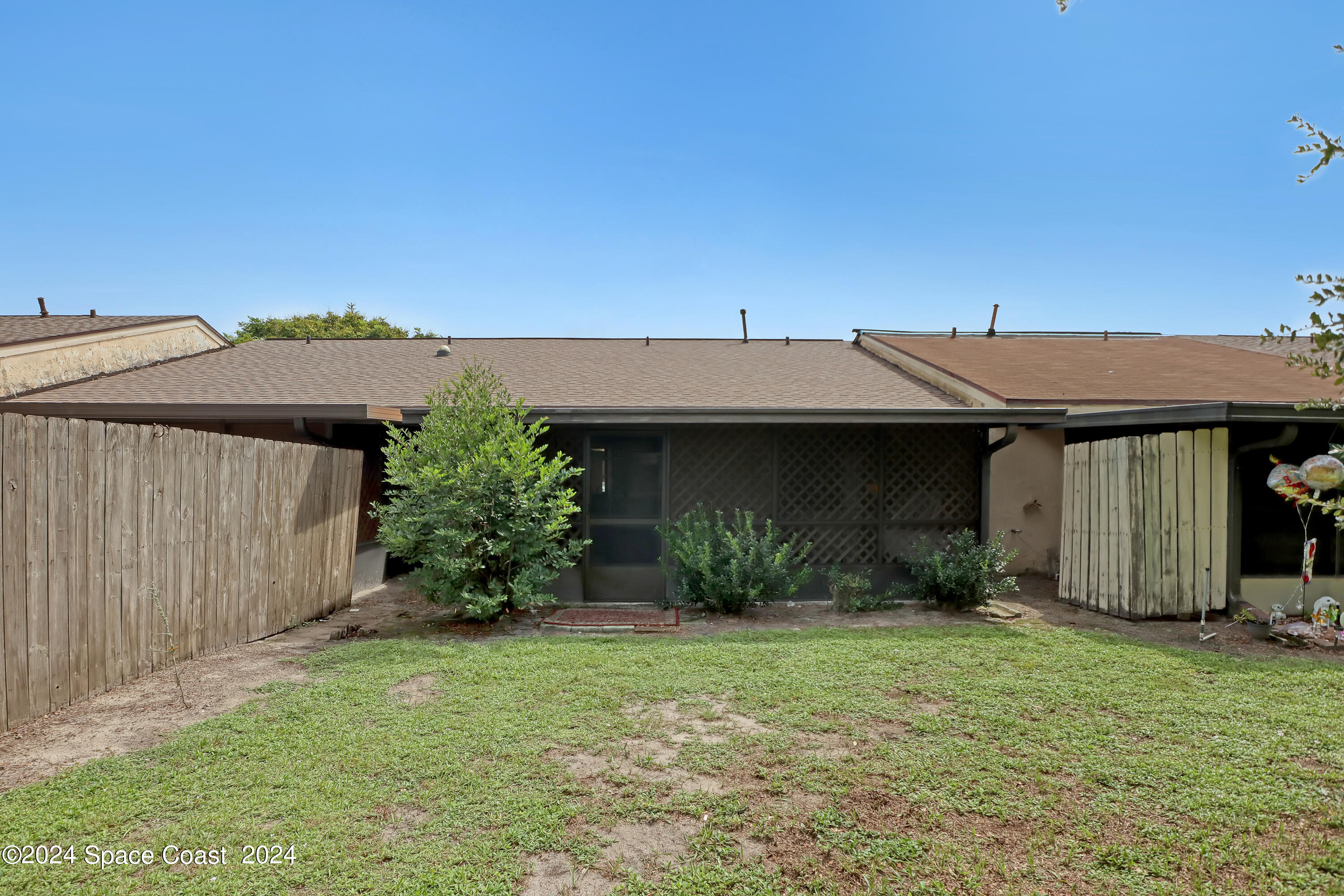 4733 Sisson Road Titusville, FL 32780 - Photo 25 of 26 a view of a house with a garden
