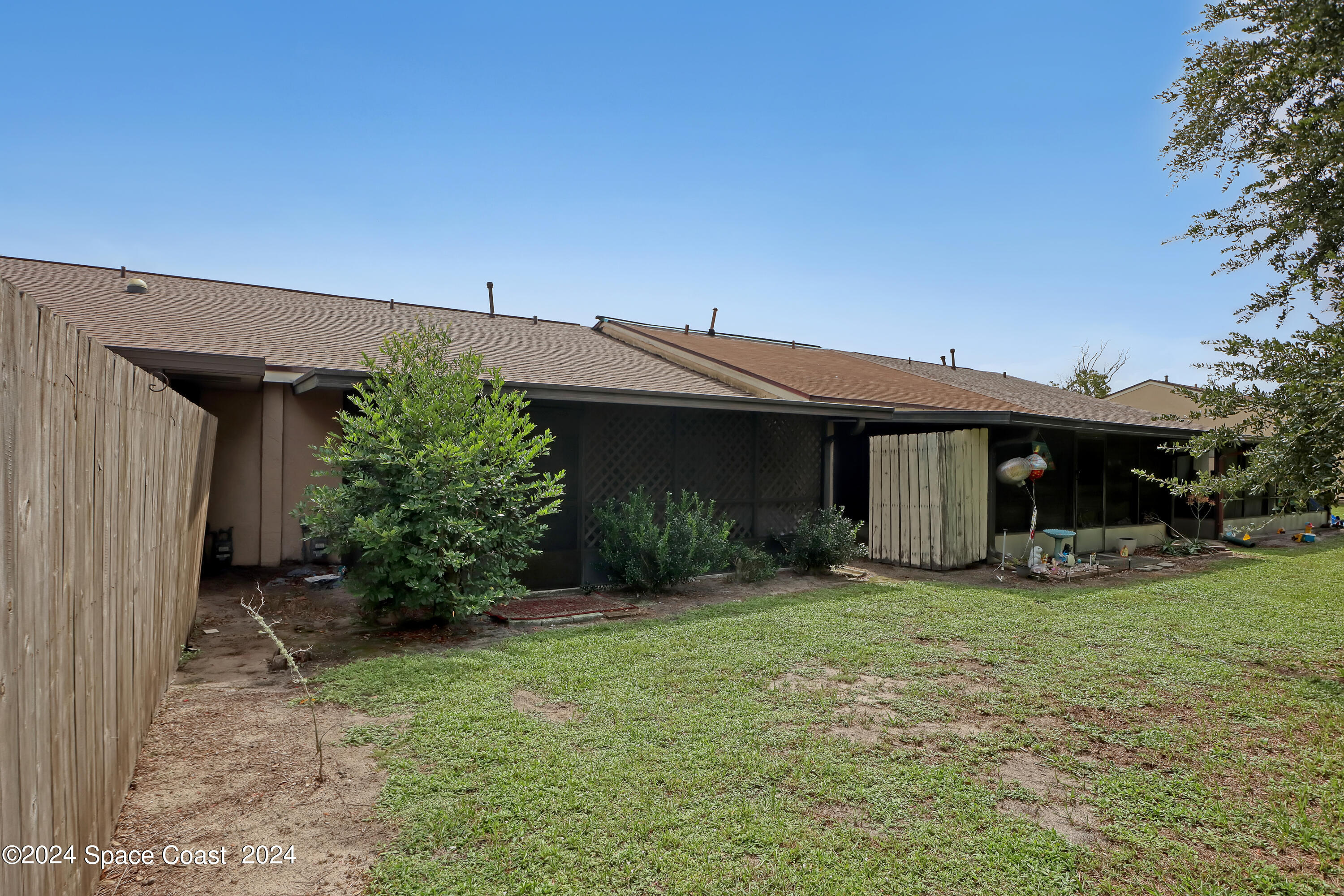 4733 Sisson Road Titusville, FL 32780 - Photo 26 of 26 a view of a house with a yard and sitting area