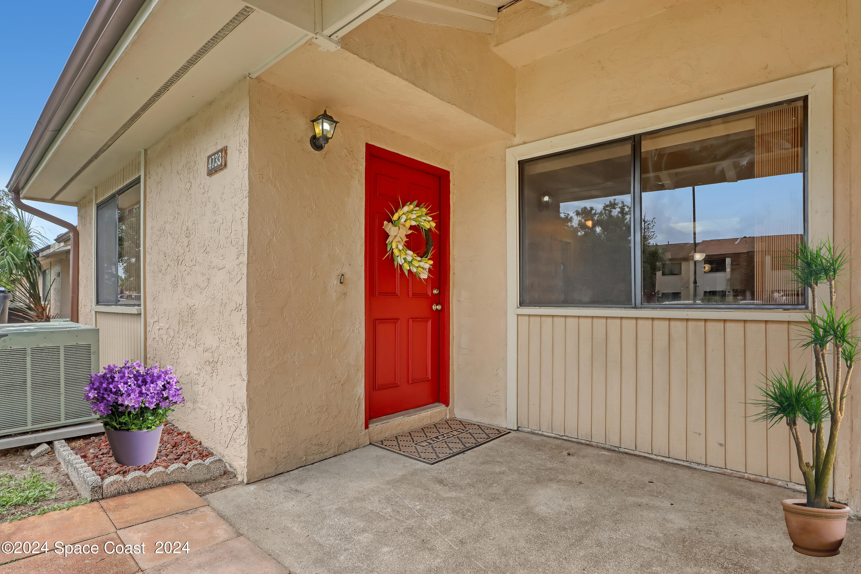 4733 Sisson Road Titusville, FL 32780 - Photo 3 of 26 a view of a house with a potted plant