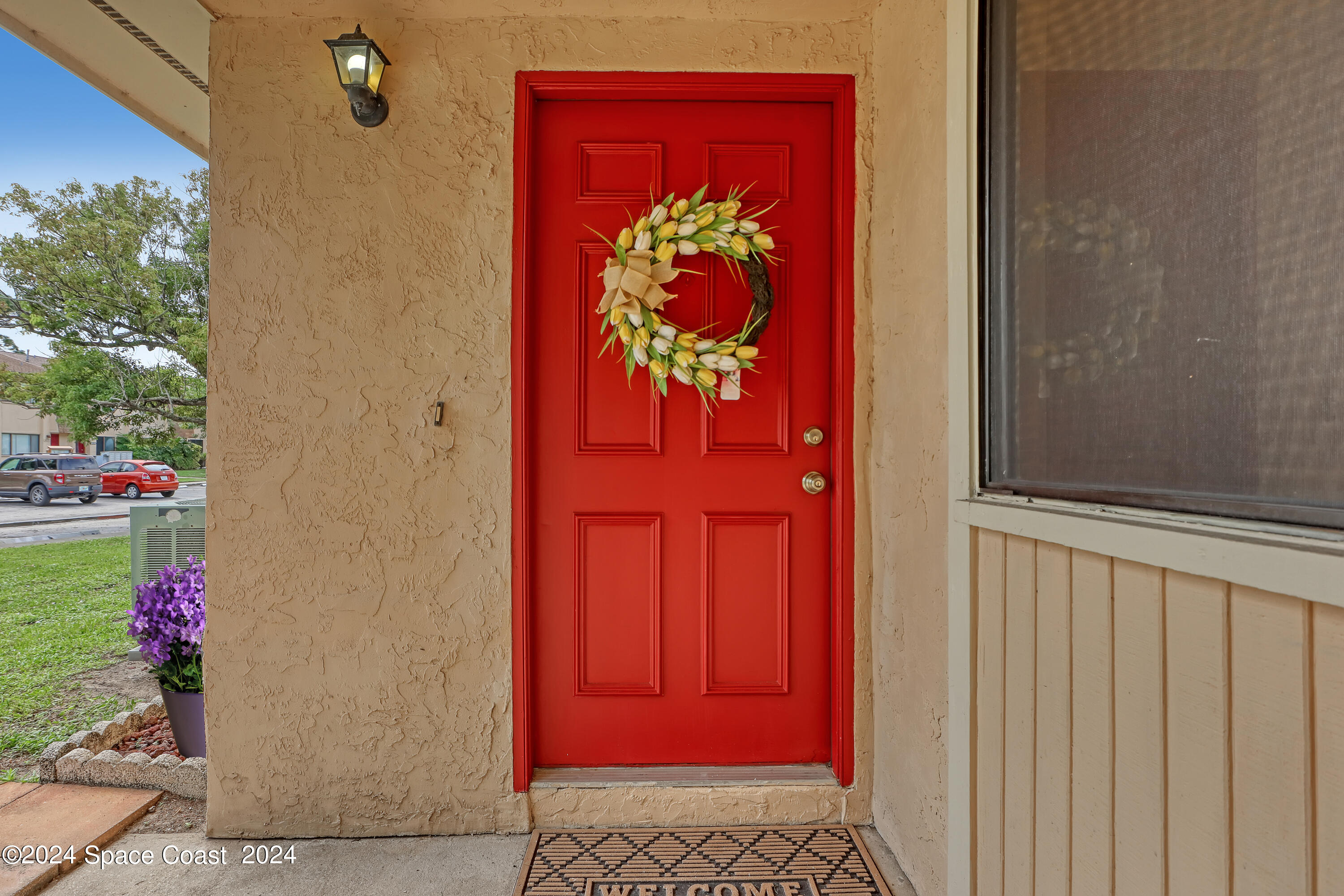 4733 Sisson Road Titusville, FL 32780 - Photo 4 of 26 a view of a red door and a red door
