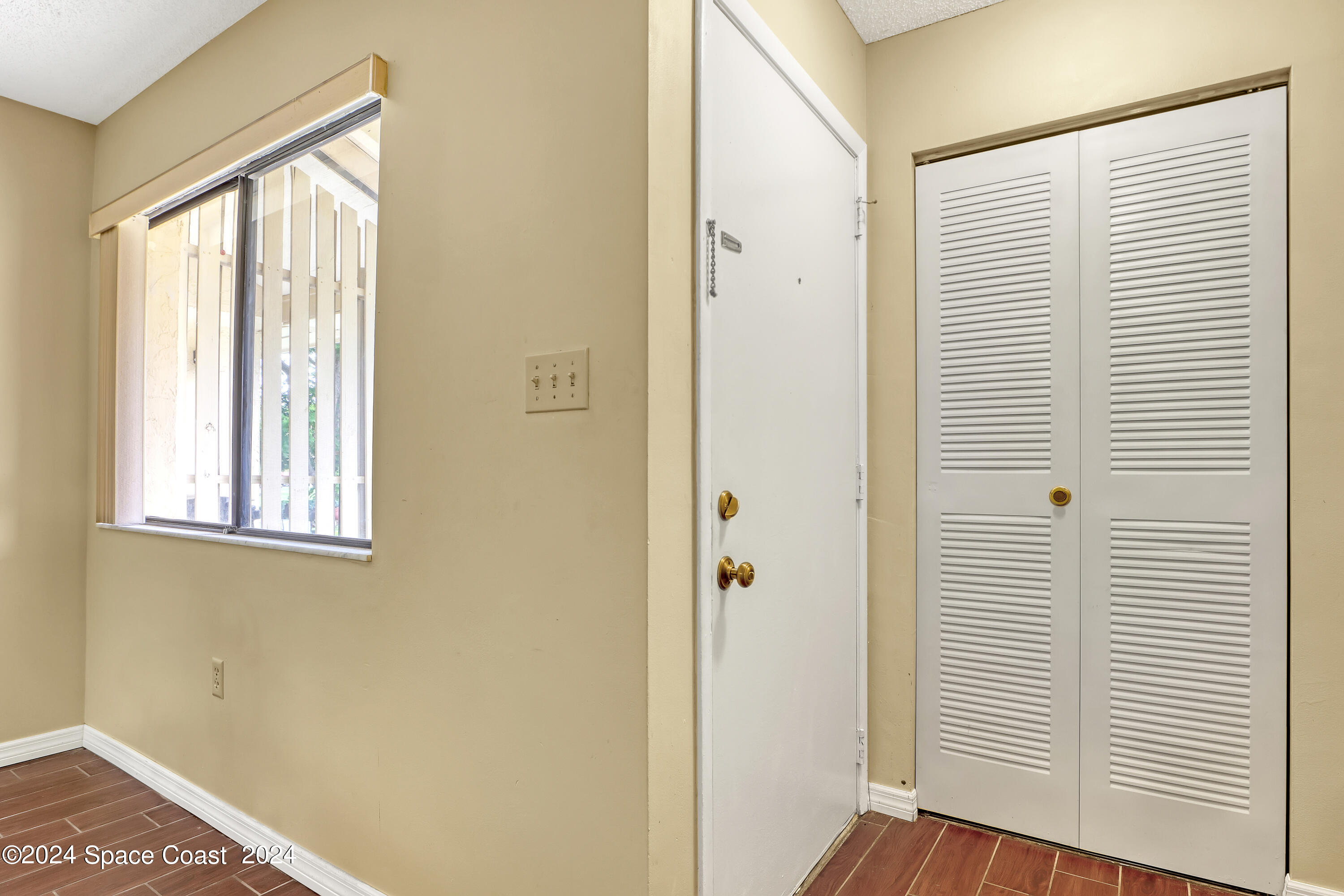 4733 Sisson Road Titusville, FL 32780 - Photo 5 of 26 a view of a room that has a window in it