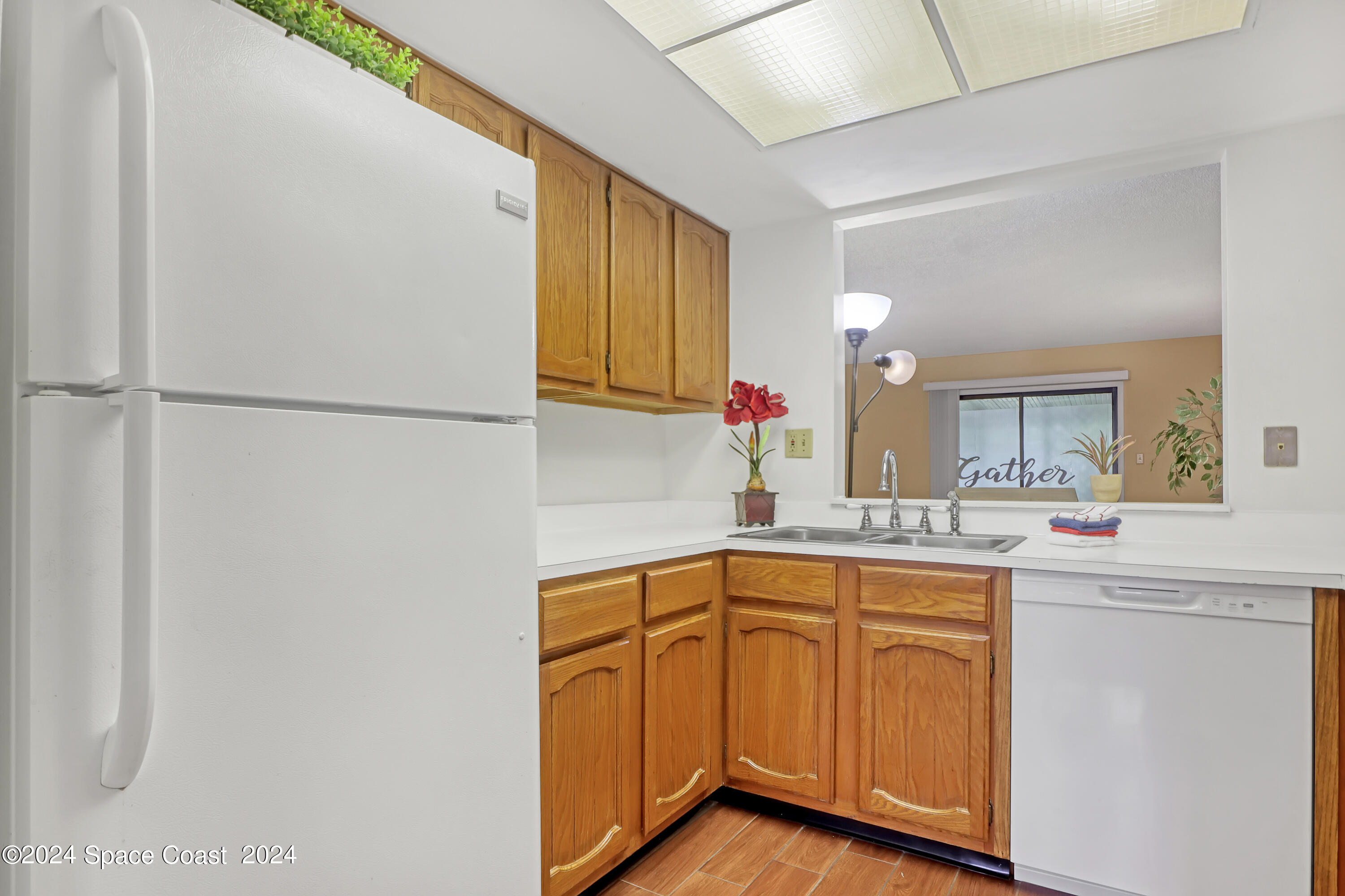 4733 Sisson Road Titusville, FL 32780 - Photo 8 of 26 a kitchen with a sink cabinets and stainless steel appliances