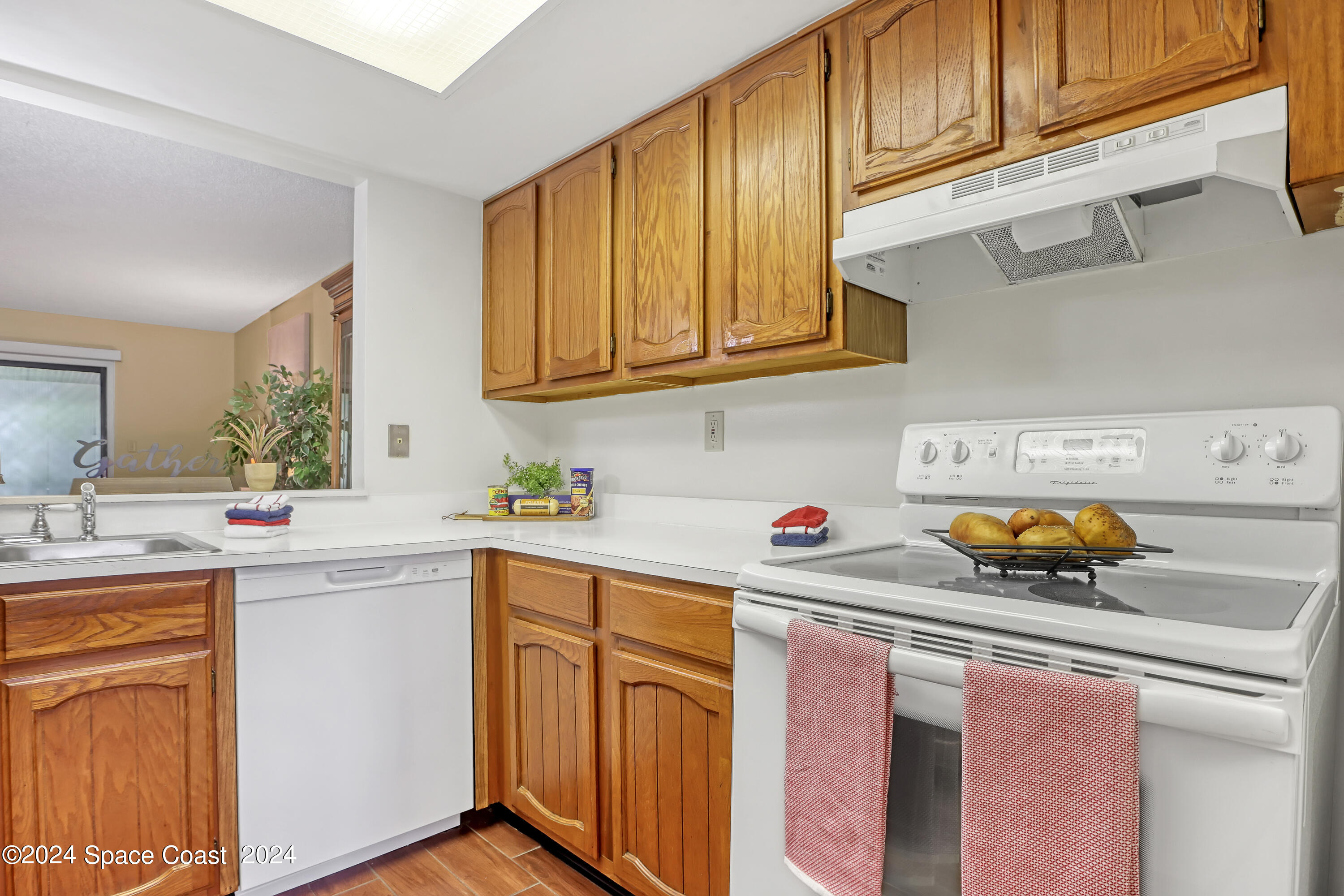 4733 Sisson Road Titusville, FL 32780 - Photo 10 of 26 a kitchen with stainless steel appliances a sink a stove and cabinets