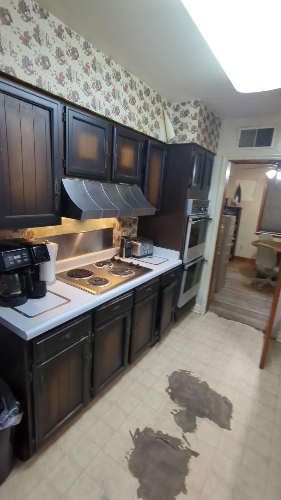 1026 Wingfield Road Memphis, TN 38122 - Photo 8 of 19 a kitchen with stainless steel appliances granite countertop a stove a sink and a microwave