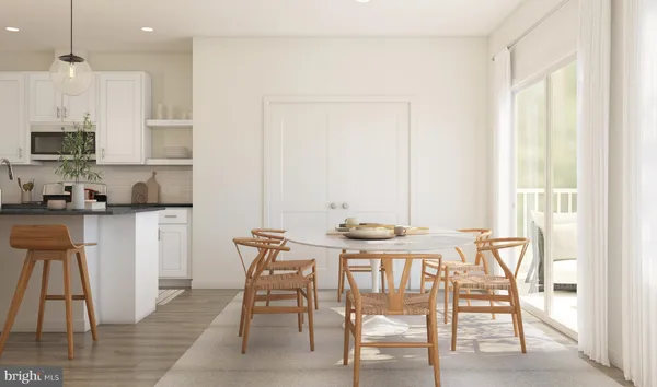 a view of a kitchen with dining area a sink and a window