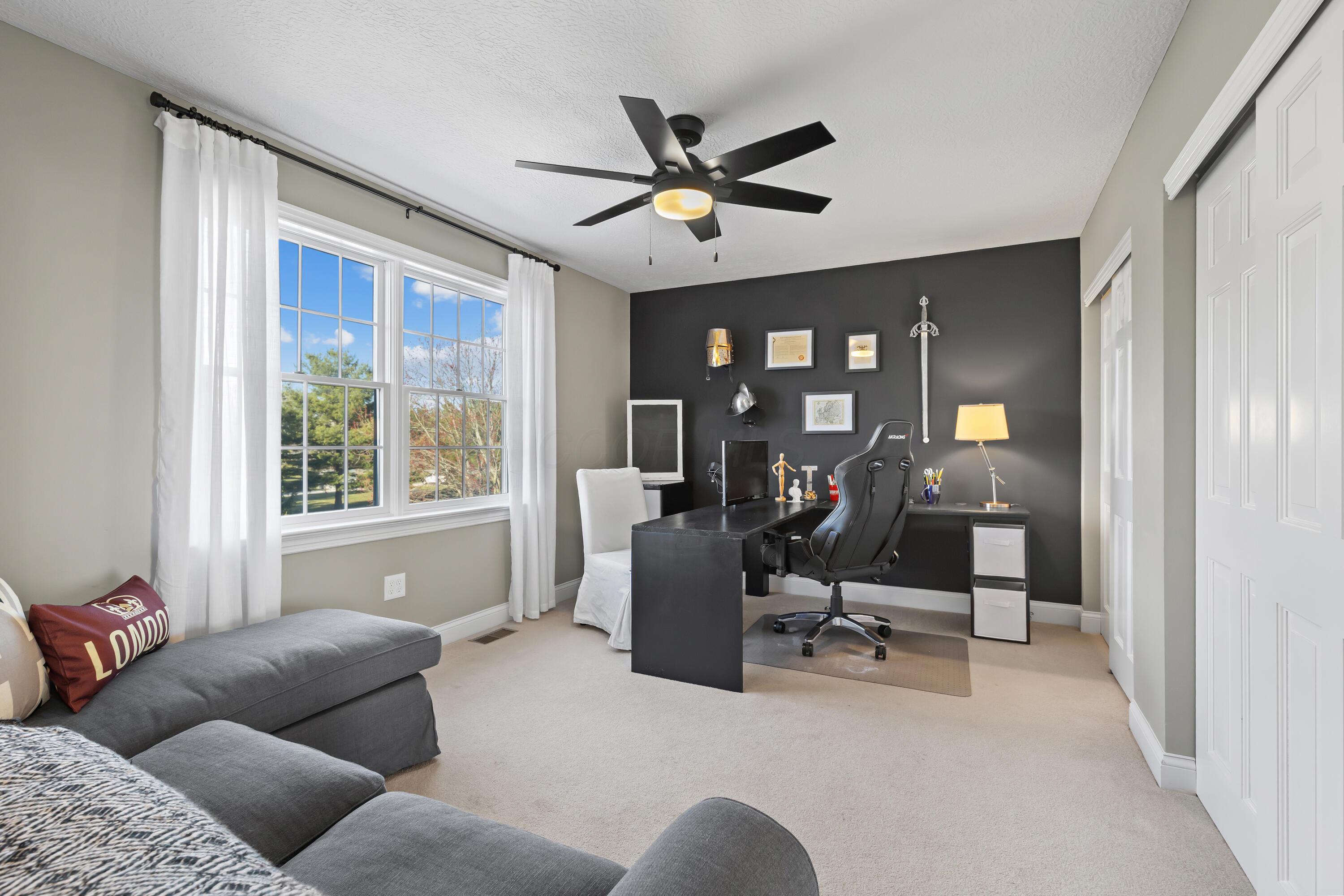1364 Dale Ford Road Delaware, OH 43015 - Photo 63 of 112 • Light sand carpet • Black & grey painted walls • Lighted ceiling fan • (2) sets of closets with double sliding doors • Wall hooks do not remain • Jack & Jill bath access • Drapes remain