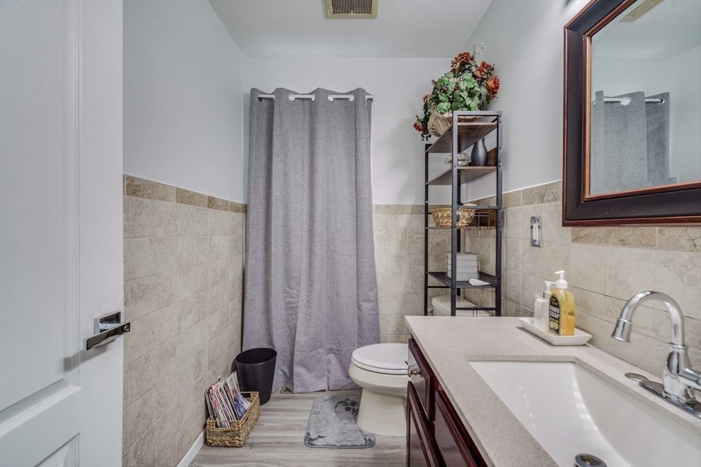 283 Christopher Drive Springfield, MA 01119 - Photo 11 of 32 a bathroom with a sink toilet and shower