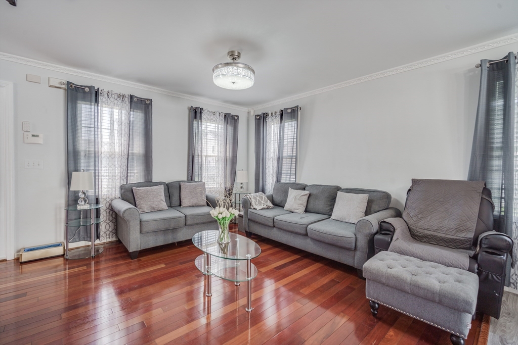 283 Christopher Drive Springfield, MA 01119 - Photo 12 of 32 a living room with furniture and a large window