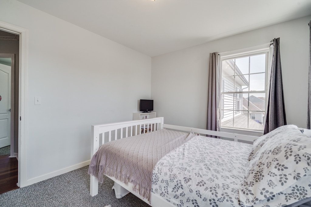 283 Christopher Drive Springfield, MA 01119 - Photo 17 of 32 a bedroom with a bed and a window