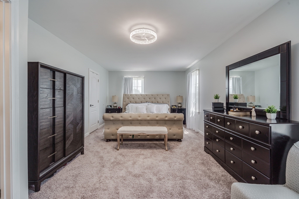 283 Christopher Drive Springfield, MA 01119 - Photo 21 of 32 a living room with furniture and a mirror